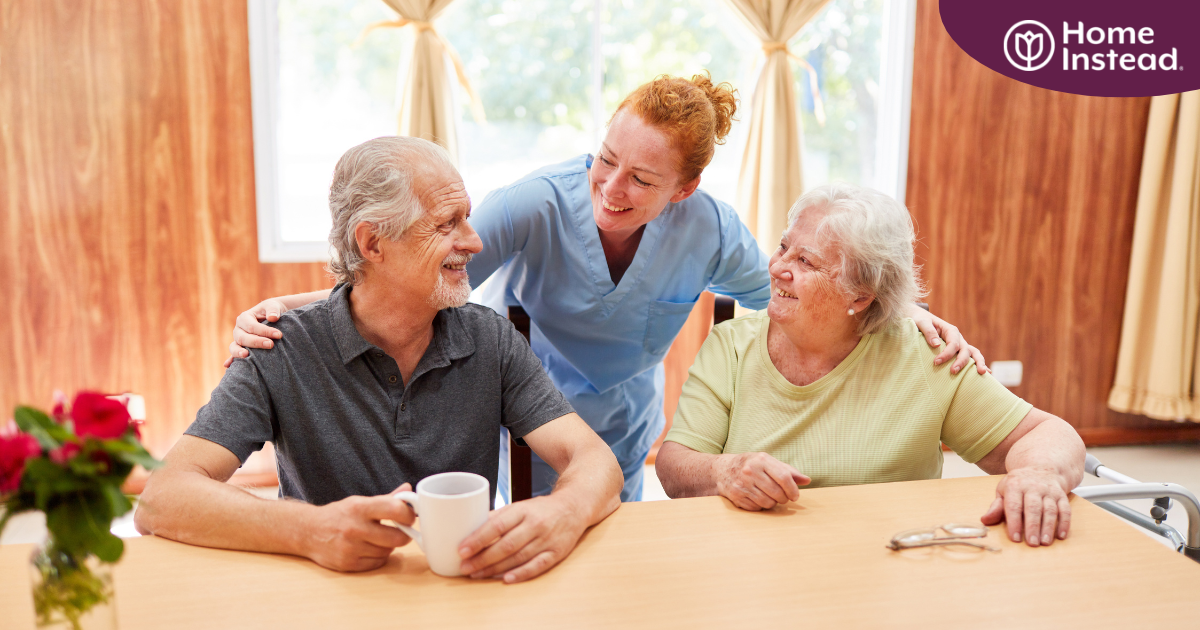 A good caregiving environment can benefit both caregiver and clients, as shown here by this caregiver and her 2 clients.