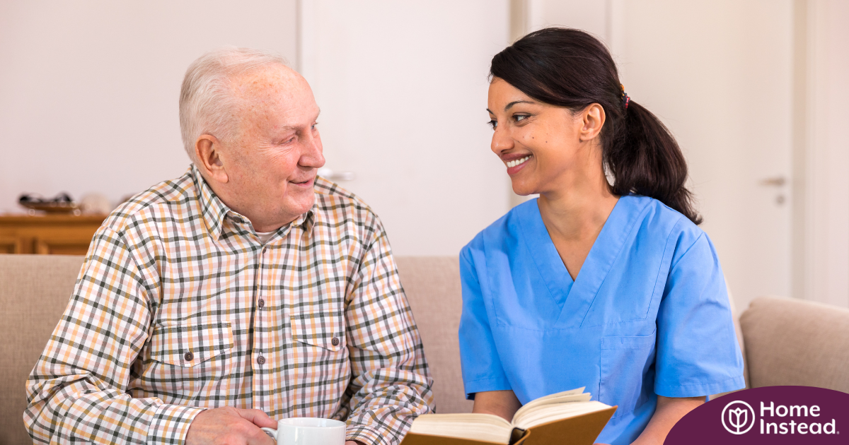 A professional caregiver enjoys her flexible career as she cares for and reads to an older client.